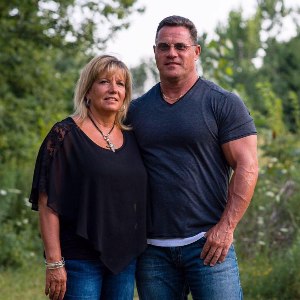 Shelly and Travis Bornstein posing for a photo.