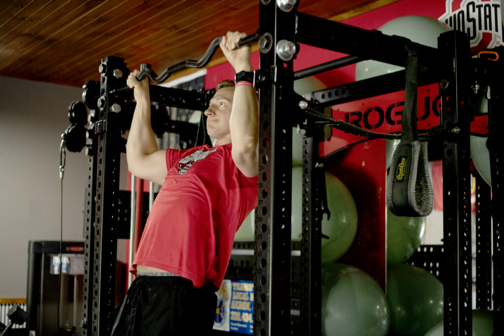Man doing pull ups on a bar