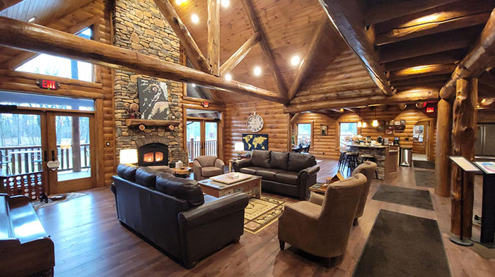 Interior view of Tyler's Redemption Place, a log cabin with vaulted ceilings.