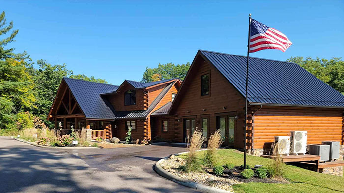 Exterior view of Tyler's Redemption Place with an American flag in the foreground