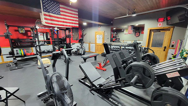 Workout gym with an American flag hanging down from the ceiling